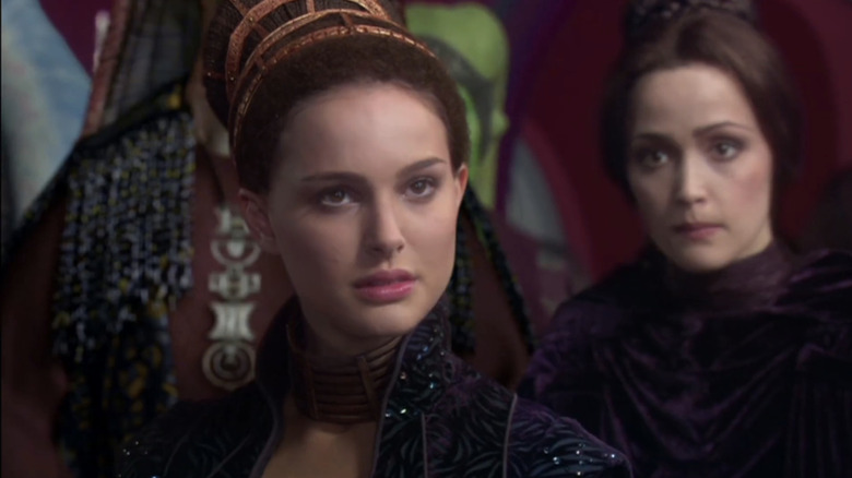 Natalie Portman's Padmé Amidala looks across frame as she sits in a room in Star Wars: Episode II – Attack of the Clones