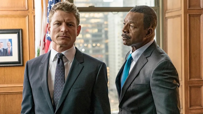 Philip Winchester like Peter Stone and Carl Westers as Mark Jefferis shares a tense moment in Chicago justice