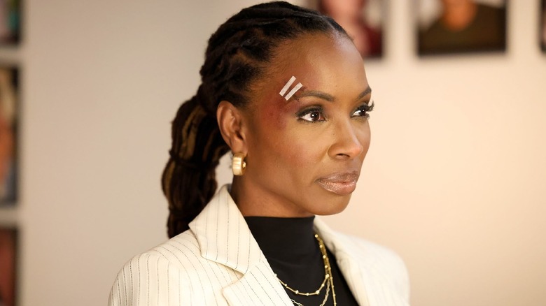 Shanola Hampton in a fool's role with bandages above her eyes to find her