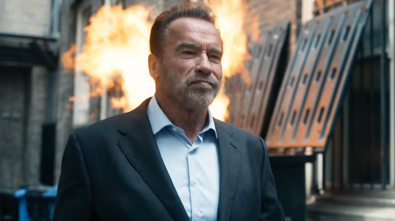 Arnold Schwarzenegger's Luke Brunner walks away from a fire in Fubar