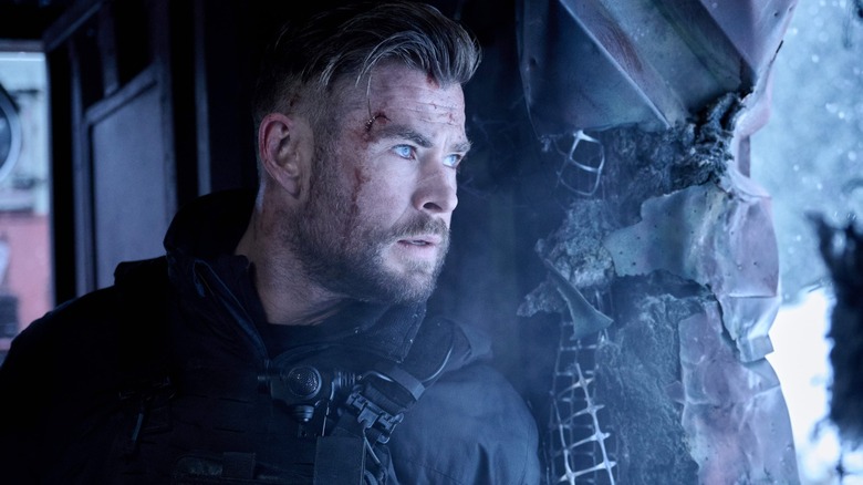 Hemsworth's Tyler Rake in the aftermath of a train stunt in Extraction 2