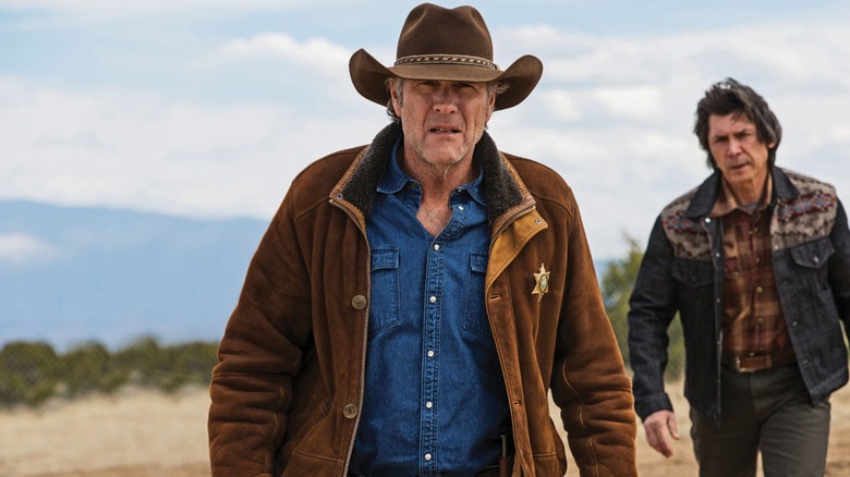 Walt being followed by Henry on Longmire
