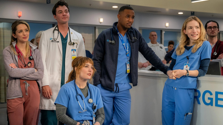 The hospital staff standing near each other in Pulse