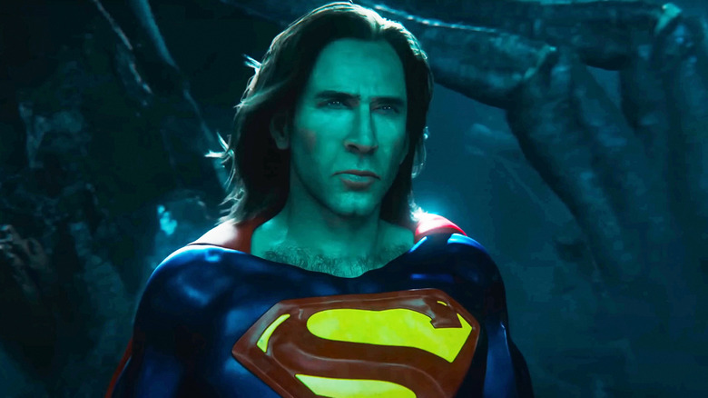 Nicolas Cage's Superman stands against a hazy green background in The Flash