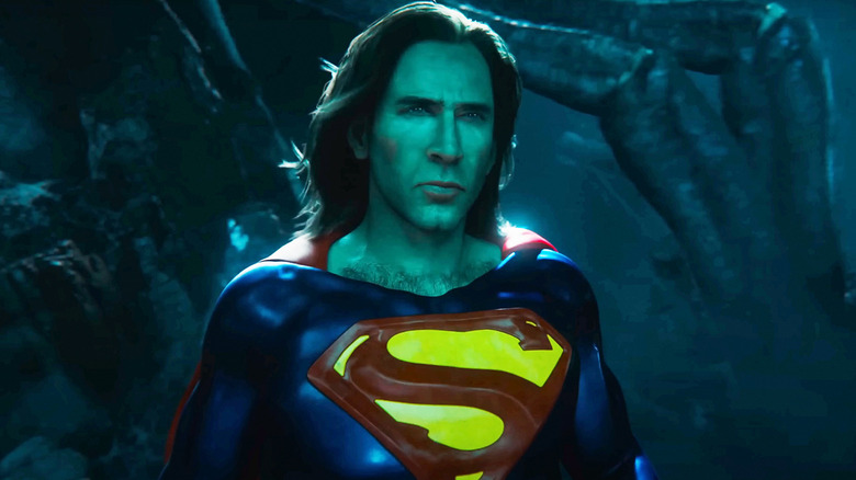Nicolas Cage's Superman stands against a hazy green background in The Flash