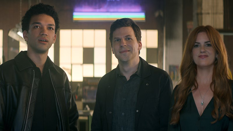 Charlie Atlas and Henley smiling at someone off-screen in Now You See Me: Now You Don't