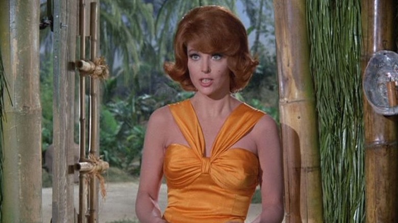 Tina Louise while ginger was standing at an entrance at an orange top on the island of Gilijan