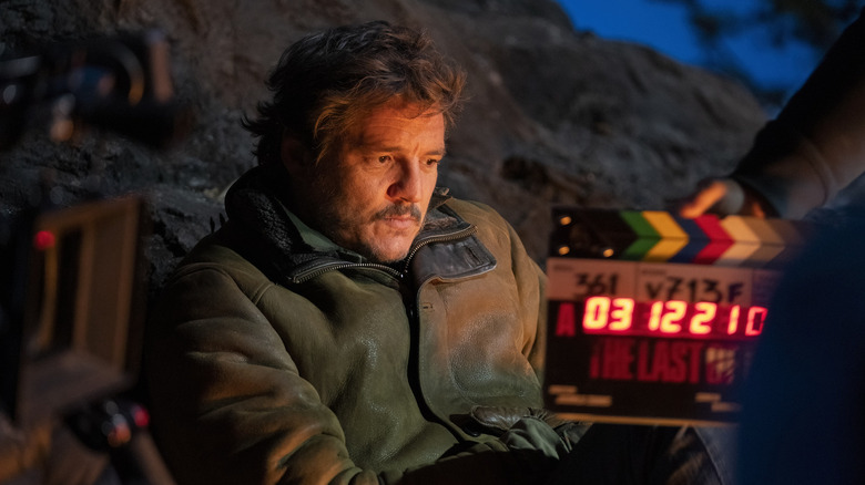 Pedro Pascal as Joel in a behind the scenes shots on the set of The Last of Us