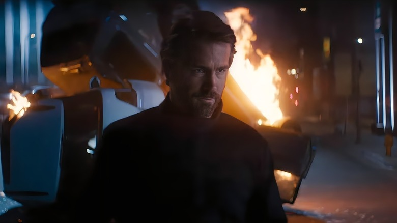 Caver the assassin walks away from an explosion in Bullet Train