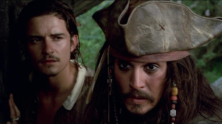 Orlando Bloom and Johnny Depp in Pirates of the Caribbean: The Curse of the Black Pearl