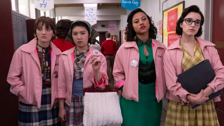 Ari Notartomaso (Cynthia), Tricia Fukuhara (Nancy), Cheyenne Wells (Olivia), Marisa Davila (Jane) run the halls in Grease: Rise of the Pink Ladies