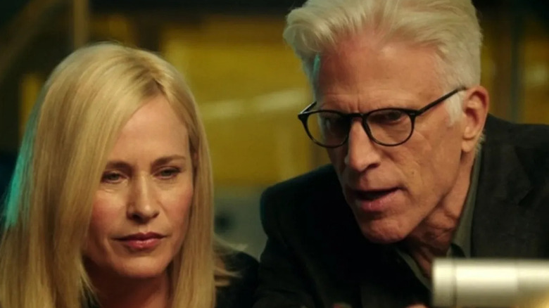 Ted Danson's D.B. Russell and Patricia Arquette's Dr. Avery Ryan observing something offscreen on CSI: Cyber