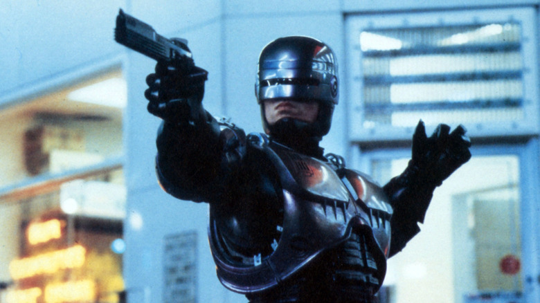 RoboCop aiming a handgun in RoboCop
