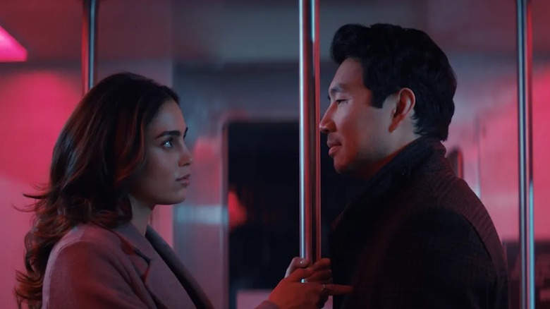 Melissa Barerra as Michelle Cyr and Simu Liu as Alexander Hale are awkwardly photographed in a subway car in The Copenhagen Test