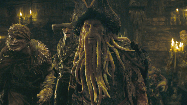 Davey Jones with his crew behind him in Pirates of the Caribbean: At World's End