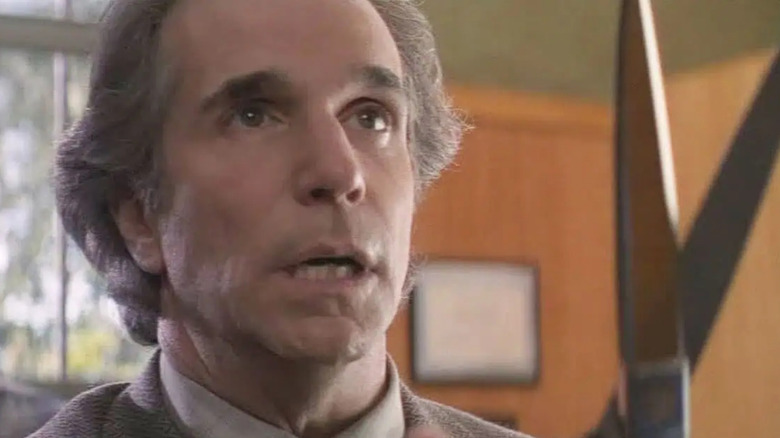 Shout, director of chemical (played Henry Winkler) with anger holding scissors