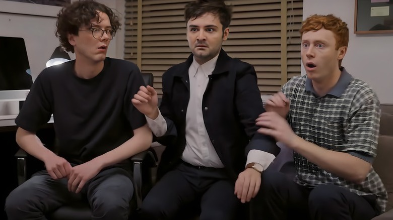 Martin, John, and Ben reacting in shock to something in their office on Please Don't Destroy