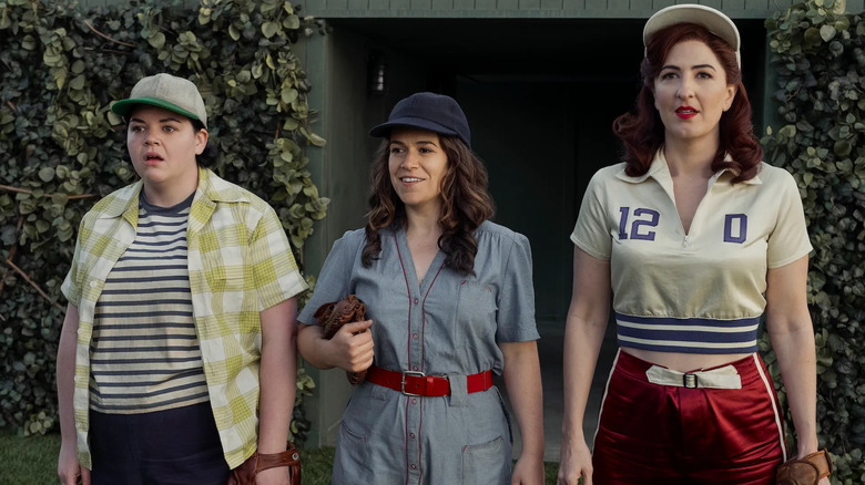 Abbi Jacobson as Carson walking out onto the field alongside D'Arcy Carden as Greta in A League of Their Own (2022)