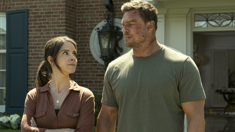 Duffy stares up at a stern Reacher in Reacher
