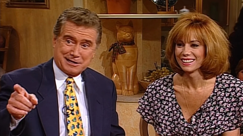 Regis Filbin shows while Katie Lee Giford looks in Seinfeld