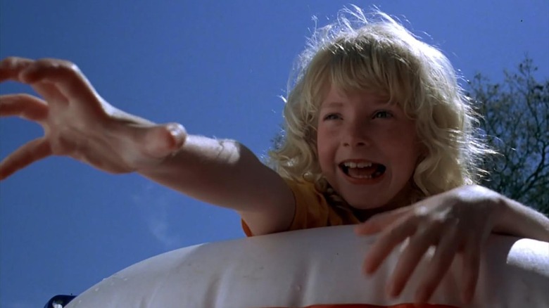 Melody Thomas Scott as Laura Dickinson reaching for help in Piranha