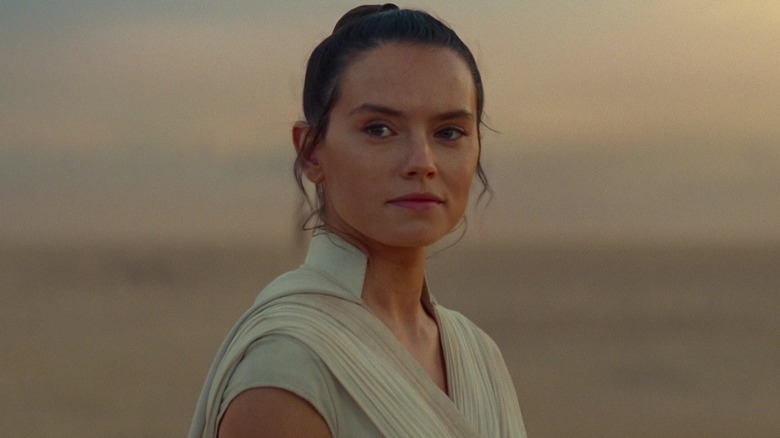 Rey looking back at the old woman on Tatooine at the end of Star Wars: The Rise of Skywalker