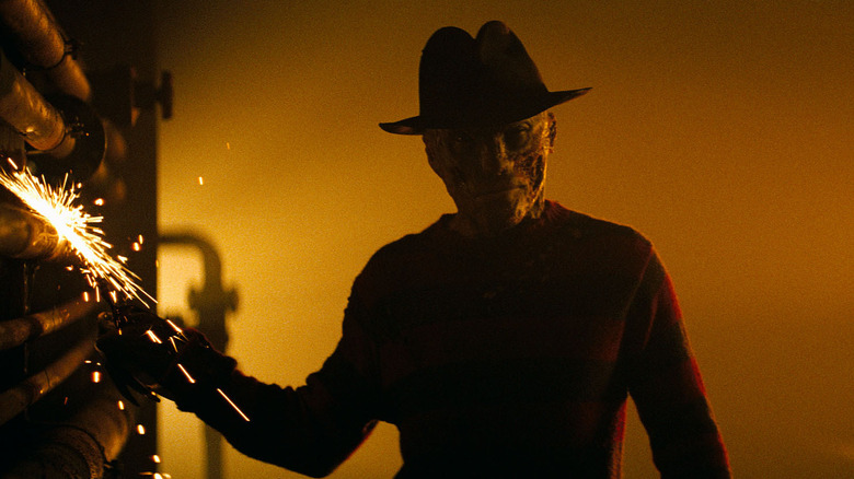 Jackie Earle Haley as Freddy Krueger dragging his claws on steel pipes in A Nightmare on Elm Street (2010)