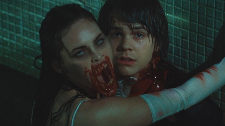 Jennifer flashing her demon mouth as she takes a bite out of Chip's neck in Jennifer's Body