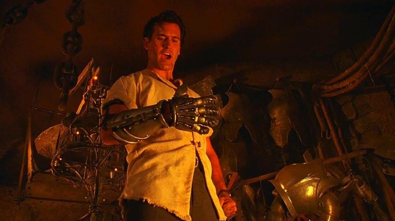 Ash trying out a robot hand in Army of Darkness