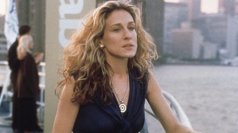 Carrie on a boat looking into the middle distance on Sex and the City