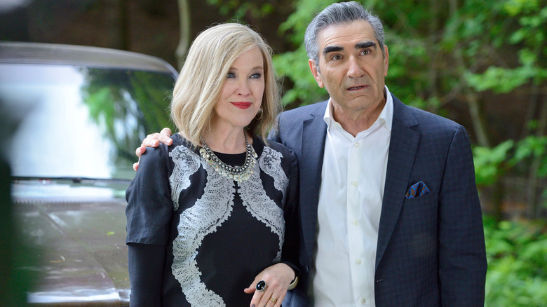 Eugene Levy as Johnny Rose with his arm around Catherine O'Hara as Moira Rose in Schitt's Creek