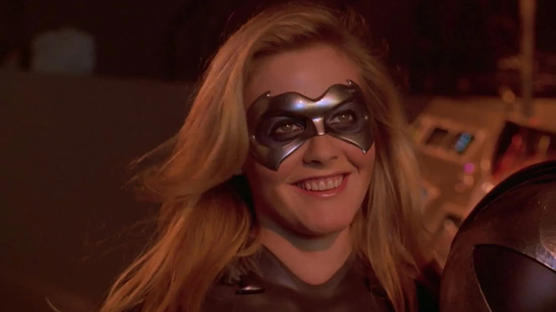 Alicia Silverstone's Batgirl wearing her costume and taking a fighting stance in Batman & Robin