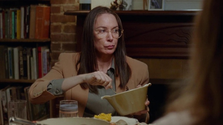 Jean serving herself scowling and wearing glasses in The Meyerowitz Stories