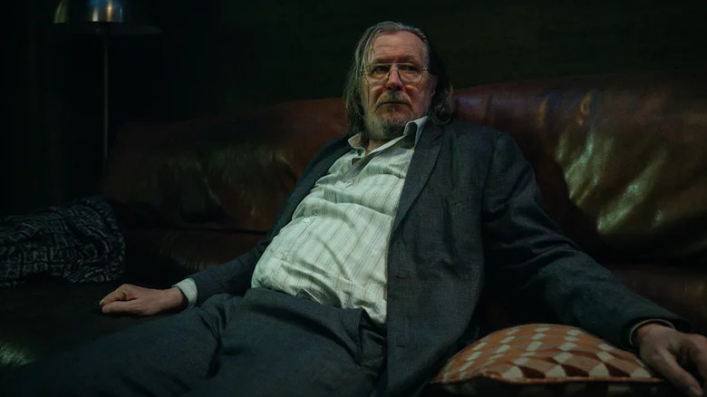 Gary Oldman's Jackson Lamb slouches on a couch in Slow Horses