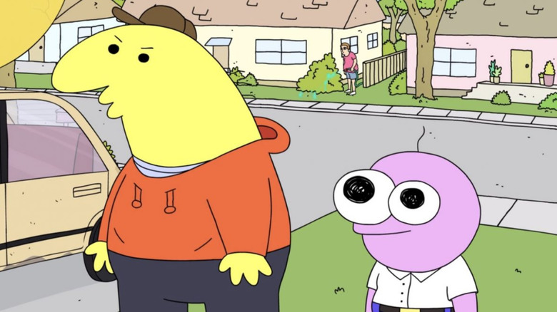 Charlie and Pim standing in a driveway on Smiling Friends