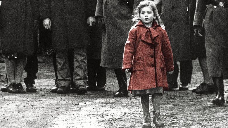A little girl in a red coat from Schindler's List