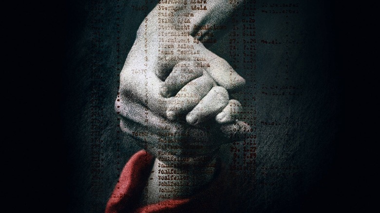 The Schindler's List poster of a larger hand holding a child's hand.