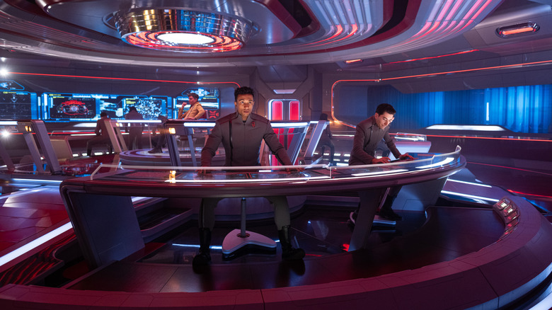Tig Notaro as Jett Reno, Sandro Rosta as Caleb Mir, and Romeo Carere as Ocam aboard a spaceship in Star Trek: Starfleet Academy