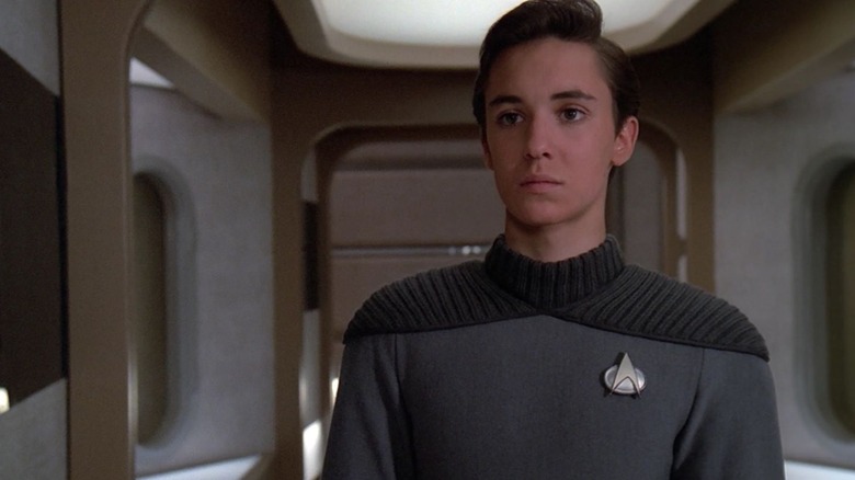Wesley Crusher in a gray costume on Star Trek: the next generation
