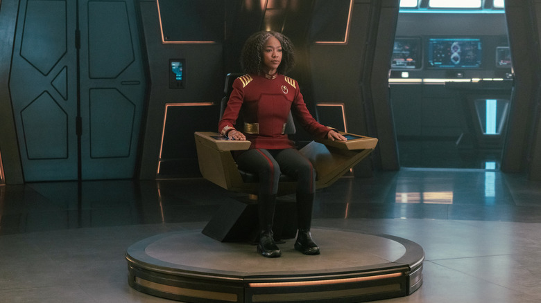 Sonequa Martin-Green as an older Captain Burnham sitting in her chair in Star Trek: Discovery