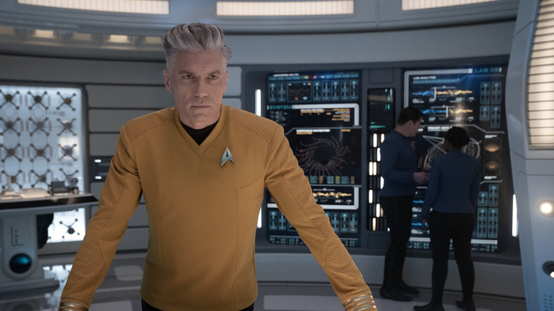 Captain Pike at a computer station in Star Trek: Strange New Worlds