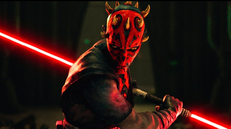 Maul wielding his lightsaber and looking incredibly cool as he swings it in Star Wars: Maul – Shadow Lord