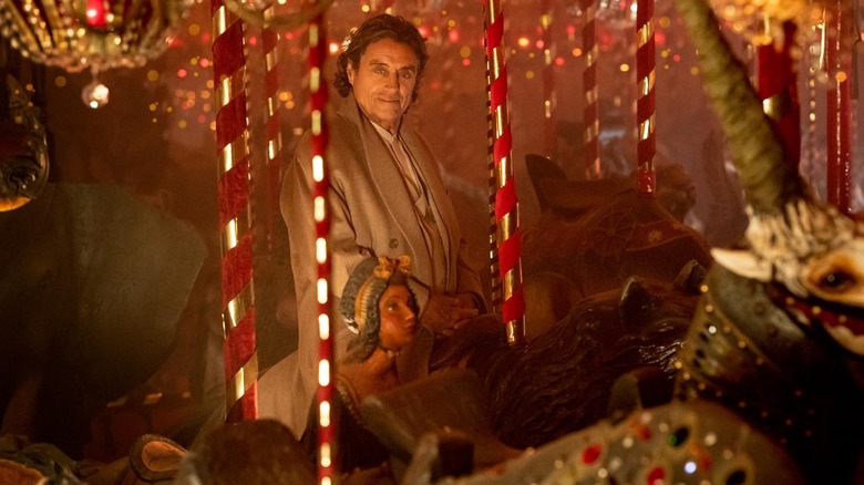 Wednesday riding on a carousel in American Gods