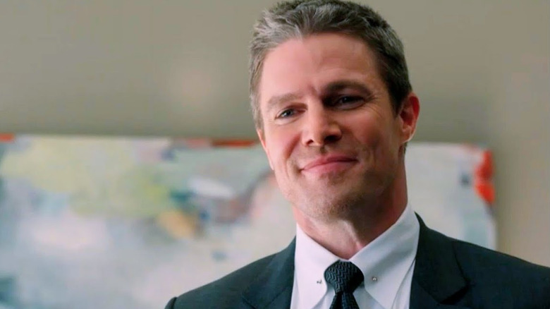 Stephen Amell as Ted Black smiling on Suits LA