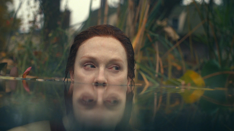 Lisey (Julianne Moore) floats in a lake with the water up to her nose in Lisey's Story