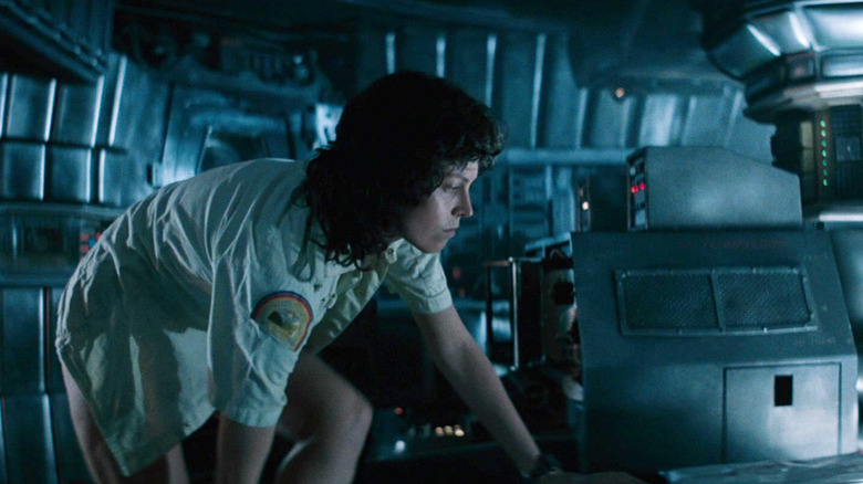 Ripley cautiously climbing around her spaceship in Alien