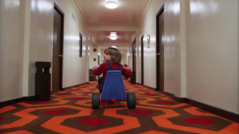 Danny Torrance riding down the halls of The Overlook