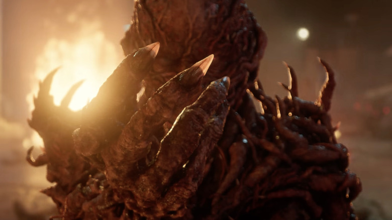 Jamie Campbell Bower's Vecna extendes his right hand in Stranger Things