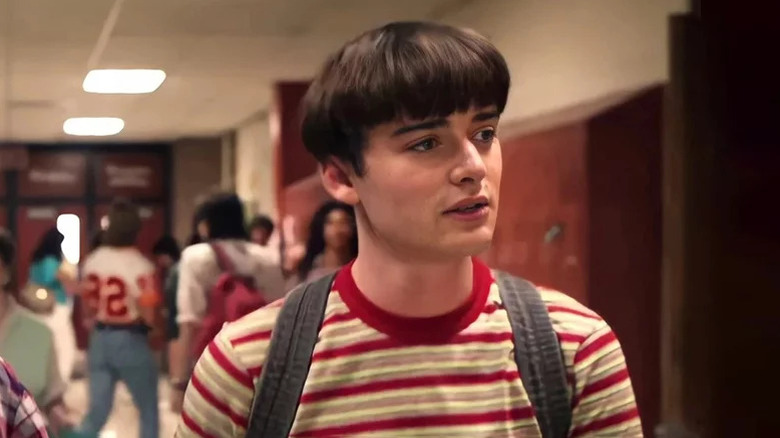 Noah Schnapp's Will Byers stands in a school hallway in Stranger Things