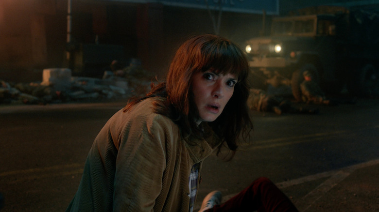Winona Ryder as Joyce Byers looking worried in Stranger Things
